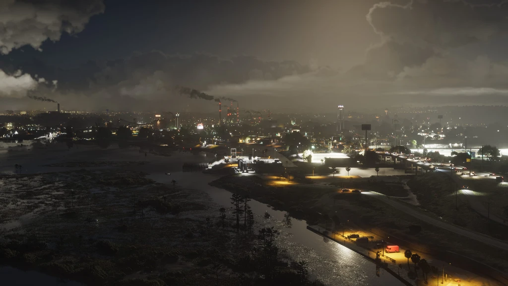Nattvy över en upplyst stad i Grand Theft Auto VI, med skorstenar som släpper ut rök under tunga moln och en flod i förgrunden.