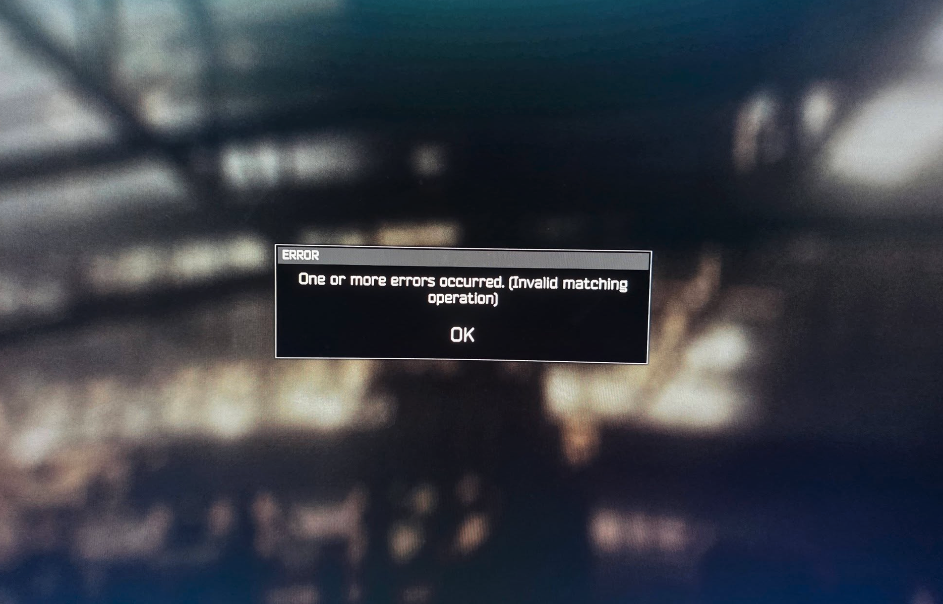 Felmeddelande i ett spel på en suddig, mörk bakgrund: "One or more errors occurred. (Invalid matching operation)" med en OK-knapp.