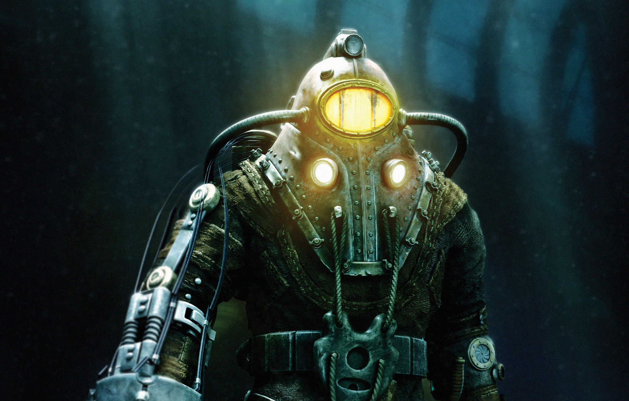 En Big Daddy i rostig, nitad dykardräkt med lysande gula ögon och ett stort borrliknande armverktyg står i det mörka, blågröna djupet. Motivet är från Bioshock 2.