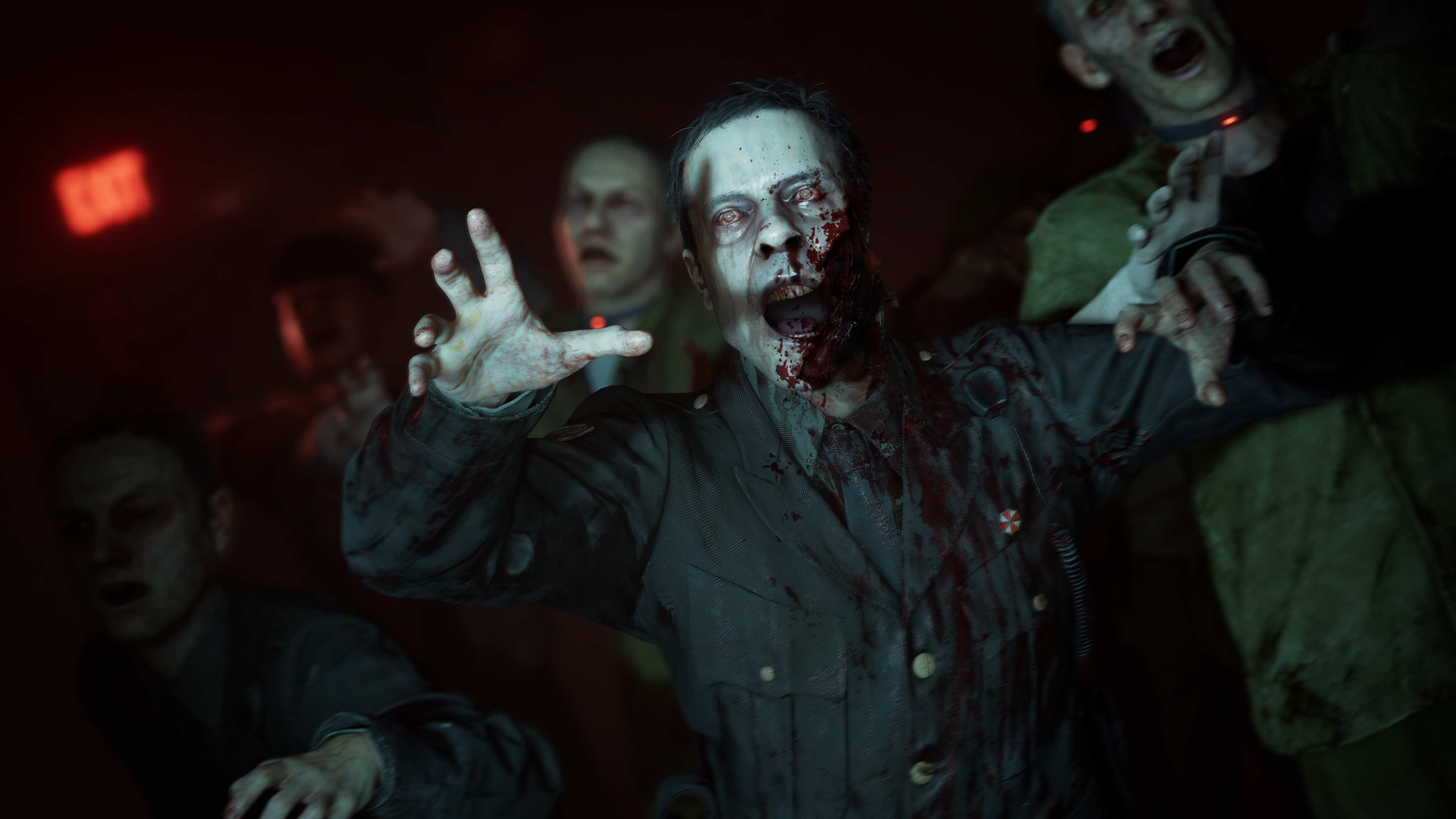 Blodiga zombier i mörker sträcker ut händerna mot kameran, i förgrunden en blek zombie i mörk uniform med öppen mun och röda ögon.