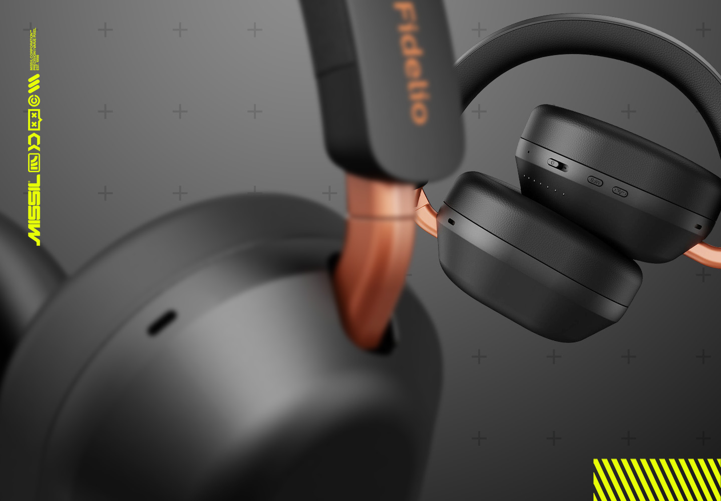 Närbild på Philips Fidelio L5 hörlurar i svart med kopparfärgade detaljer, ett par i skarpt fokus med knappar på hörsnäckan och ett suddigt i förgrunden.